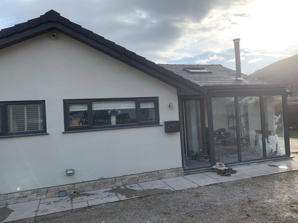 Applying new render to exterior of house